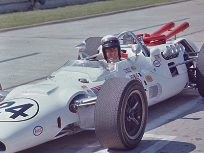 Jackie Stewart in his freshly-built #24 Bowes Fast Seal Lola T92 at the 1967 Indy 500. Licenced by The Henry Ford under Creative Commons licence Attribution-NonCommercial-NoDerivs 2.0 Generic. Original image has been cropped.