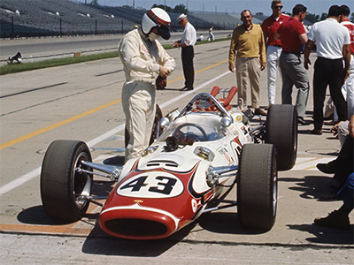 Jackie Stewart with his Lola T90 at the Indianapolis Motor Speedway in 1966.  Copyright Indianapolis Motor Speedway. Copyright permissions granted for non-commercial use by Indianapolis Motor Speedway.