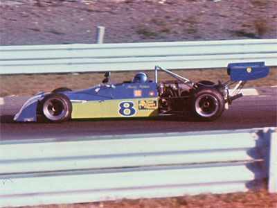 Howdy Holmes in his Chevron B27 at Watkins Glen in October 1974. Copyright Allen Brown (slide acquired on eBay) 2019. Used with permission.