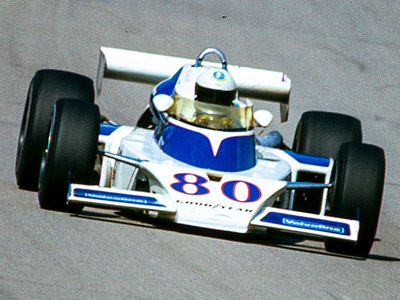 Larry Dickson in Russ Polak's McLaren M16E at Michigan in 1976. Copyright Richard Deming 2016. Used with permission.