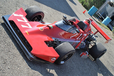 Derek Harling's Lola T460 in the paddock at Watkins Glen in 2009. Copyright Derek Harling 2021. Used with permission.