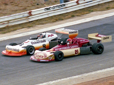 Bobby Scott and John Gibb in their March 77Bs at Kyalami in 1977. Copyright David Pearson (<a href='http://www.motoprint.co.za/' target='_blank'>motoprint.co.za</a>) 2024. Used with permission.