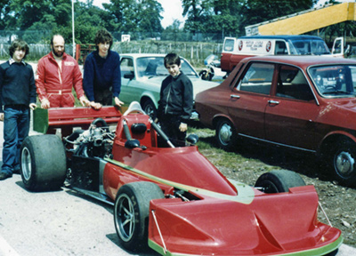 John Holmes with his March 772P-Rover turbo and his team, believed to be at a test session at Oulton Park in 1984. Copyright David Tuck 2021. Used with permission.